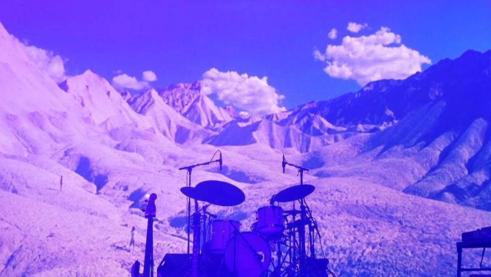 The massive backdrop landscaped beautiful desert hills in anticipation for Tycho's arrival on stage.