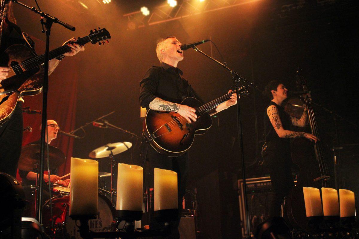 All band members in frame performing "Paint My Face," including new drummer Stefan Amidon.
